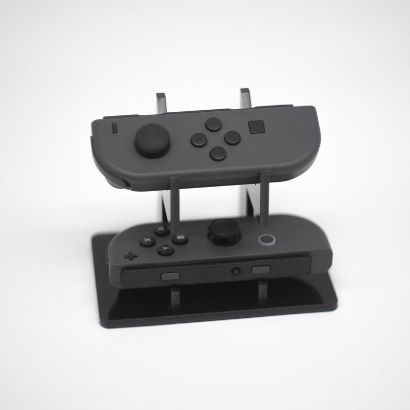 Gray Nintendo Switch Joy-Con L and R wireless controller pair with wrist straps