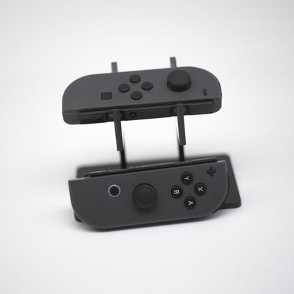 Gray Nintendo Switch Joy-Con L and R wireless controller pair with wrist straps