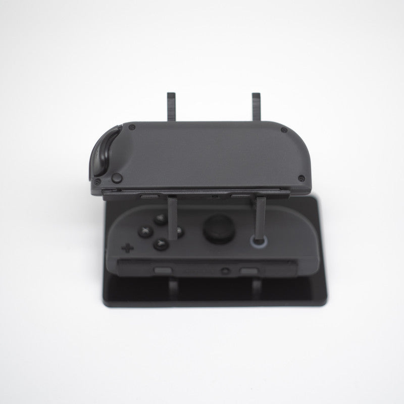 Gray Nintendo Switch Joy-Con L and R wireless controller pair with wrist straps