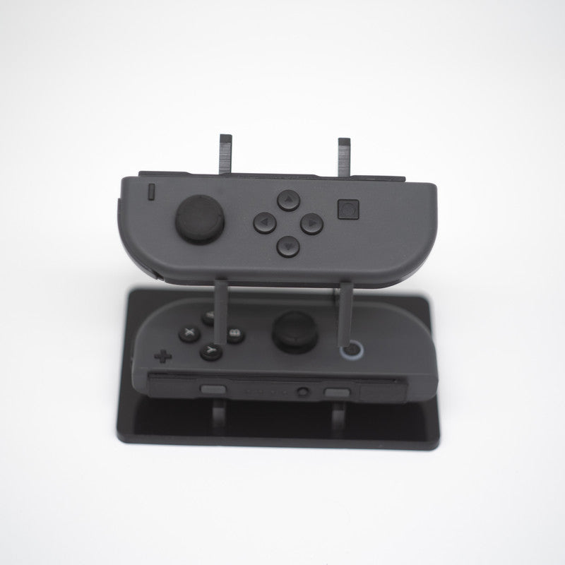 Gray Nintendo Switch Joy-Con L and R wireless controller pair with wrist straps