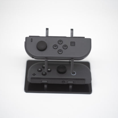 Gray Nintendo Switch Joy-Con L and R wireless controller pair with wrist straps